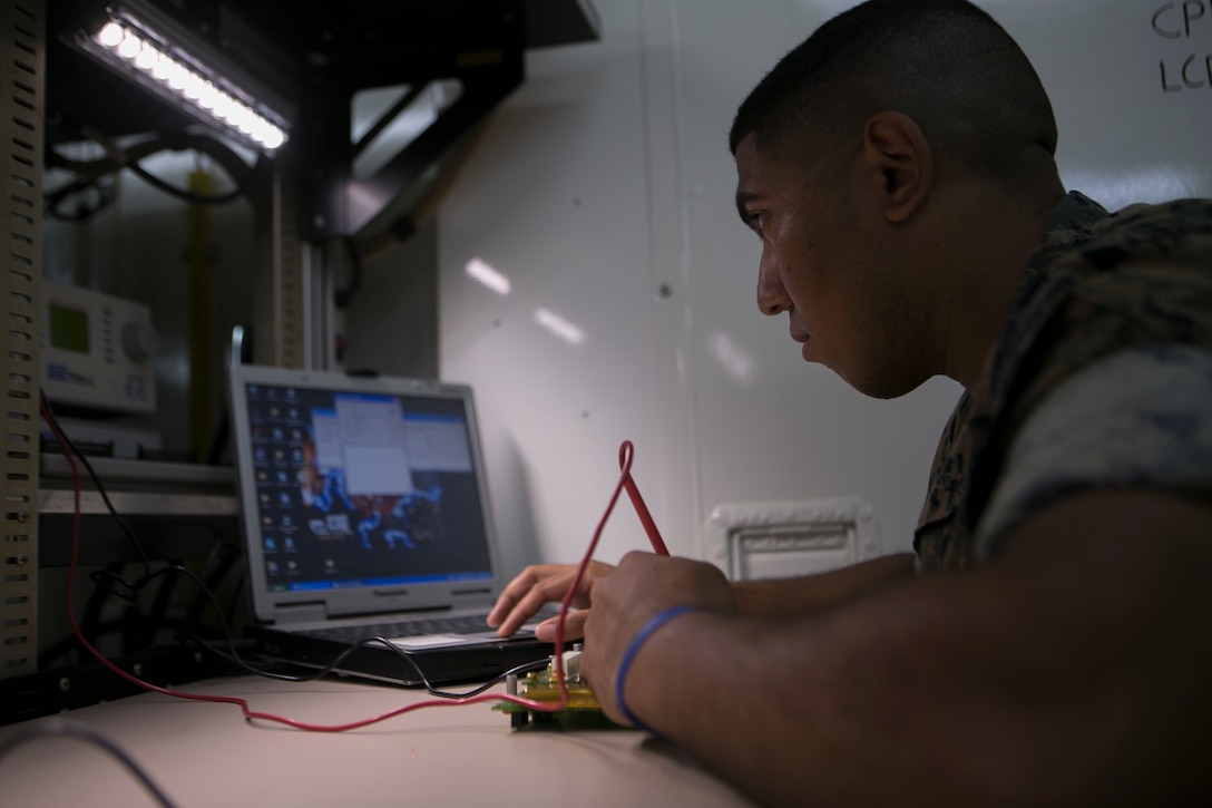 Lance Cpl. Joshua Lowry diagnoses a faulty circuit card on Camp Courtney June 2, 2016. He is pin-pointing where the damaged is located by sending a current through the circuit and watching for a response. Lowry, a Bergen County, New Jersey, native, is a miniature/ micro-miniature technician with Maintenance Platoon, Communications Company, Headquarters Battalion, 3rd Marine Division, III Marine Expeditionary Force
