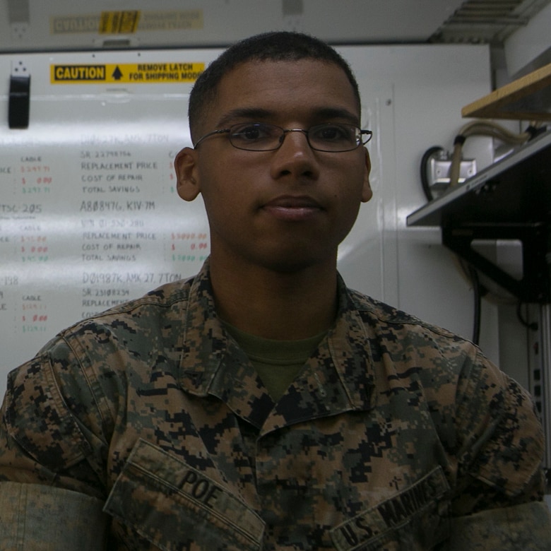 Cpl. Derek Poe poses for a photo on Camp Courtney, Okinawa, Japan, June 2, 2016. He repairs circuit cards which are a key component for almost every electronic equipment used by the Marine Corps. Poe is a Dequincy, Louisiana, native, and the section chief of the miniature/ micro-miniature section for Maintenance Platoon, Communications Company, Headquarters Battalion, 3rd Marine Division, III Marine Expeditionary Force. (U.S. Marine Corps photo by Cpl. Tyler Ngiraswei/ Released)