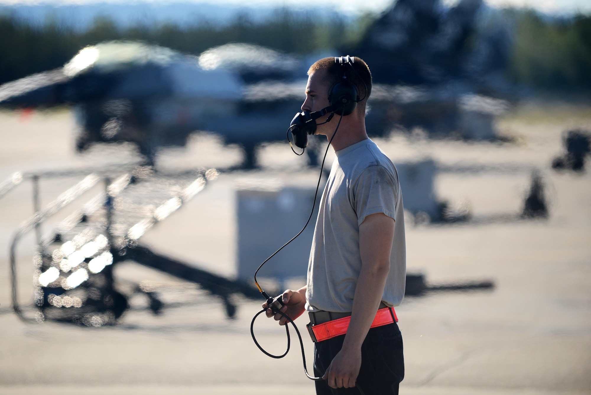 U.S. Air Force Airman 1st Class Michael Brinkmeyer, an F-16 Fighting Falcon assistant dedicated crew chief with the18th Aircraft Maintenance Unit, completes final checks with the pilot during RED FLAG-Alaska 16-2, on Eielson Air Force Base, Alaska, June 15, 2016. (U.S. Air Force photo by Tech. Sgt. Steven R. Doty)
