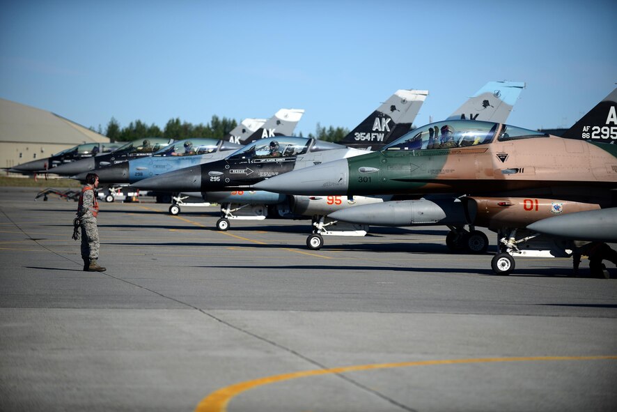 U.S. Air Force Staff Sgt. William Robb, a resource advisor and F-16 Fighting Falcon dedicated crew chief with the18th Aircraft Maintenance Unit, supervises arming procedures during RED FLAG-Alaska 16-2, on Eielson Air Force Base, Alaska, June 15, 2016. (U.S. Air Force photo by Tech. Sgt. Steven R. Doty)
