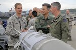 U.S. Air Force Staff Sgt. Jerry Boomers, left, assigned to the 3rd Maintenance Group, interacts with Japan Air Self Defense Force Lt. Gen. Hiroaki Maehara, center, the vice commander of Air Defense Command, and Royal New Zealand Air Force Air Commodore Darryn Webb, air component commander, during a static display presentation for RED FLAG-Alaska (RF-A) 16-2, Executive Observer Program at Joint Base Elmendorf-Richardson, Alaska, June 10, 2016. Senior air leaders, from Bangladesh, Canada, Finland, Germany, Indonesia, Japan, Mongolia, New Zealand, the Philippines, Sri Lanka, Sweden, Thailand and the U.S., were on JBER to observe RED FLAG-Alaska, a series of Pacific Air Forces commander-directed training exercises for U.S. and international forces to provide joint offensive, counter-air, interdiction, close air support, and large force employment in a simulated combat environment. (U.S. Air Force photo/Alejandro Pena)