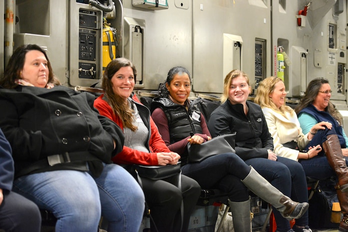 Members of the Joint Base Charleston Key Spouse program ride on a C-17 Globemaster III during an orientation flight of JB Charleston and the North Auxiliary Air Field, March 5, 2016. The aerial tour was one of the many ways the Key Spouse program helps military members and their loved ones settle into life both in the service and in the Charleston area. (U.S. Air Force Photo/Airman 1st Class Thomas Charlton)