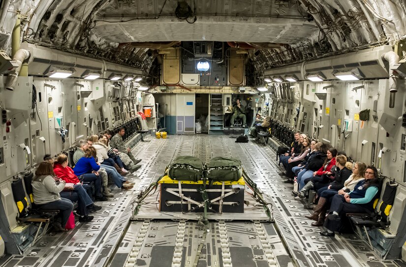 Members of the Joint Base Charleston Key Spouse program participate in an aerial tour of Joint Base Charleston and the North Auxiliary Air Field, March 5, 2016. Key Spouses organize events with different units on base to provide military spouses with better connections to other wives and husbands on the base; helping increase their knowledge of the mission. (U.S. Air Force Photo/Airman 1st Class Thomas Charlton)