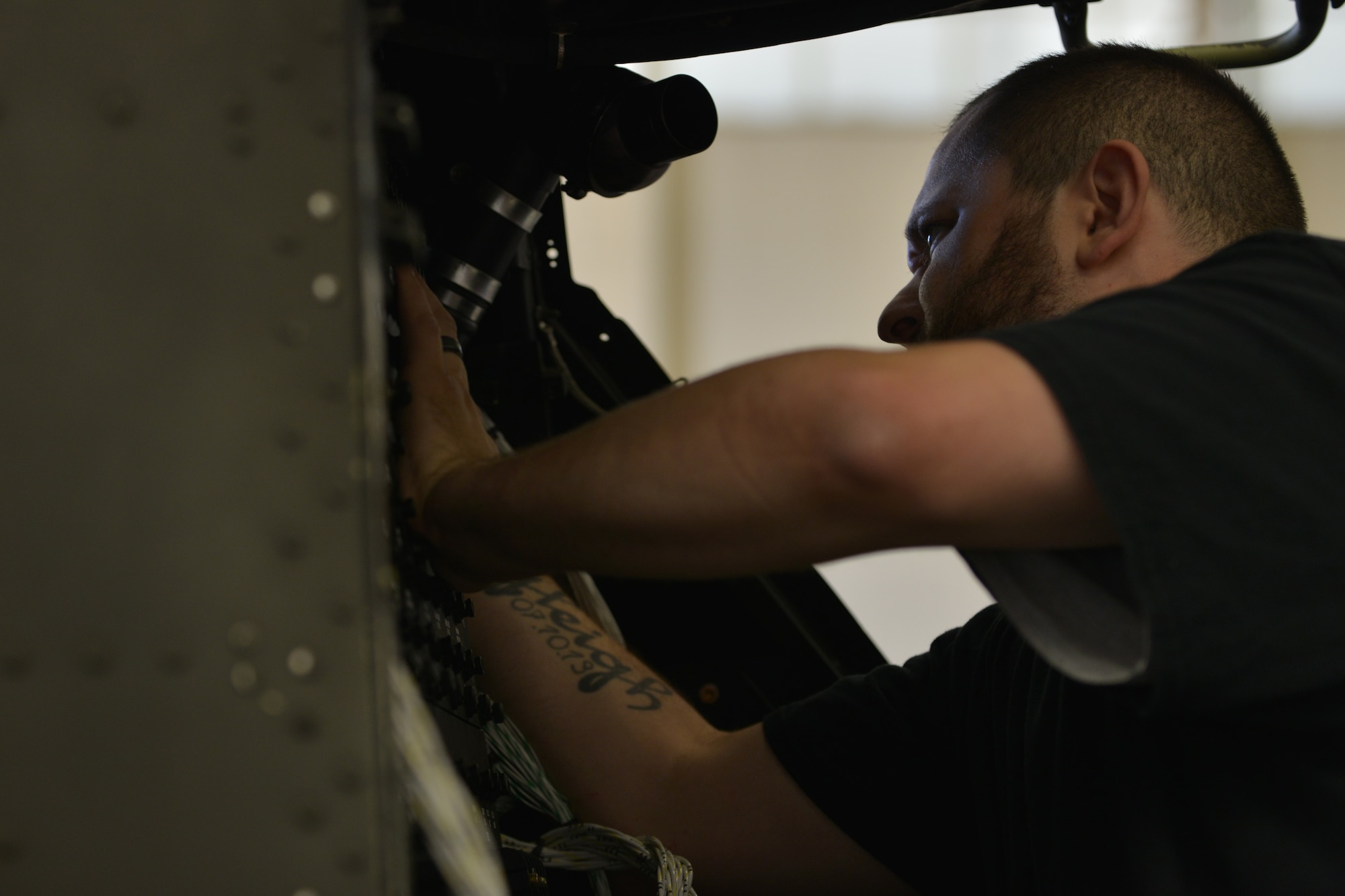Barney Crews, U.S. Falcon Inc. avionics technician, installs a new power distribution panel into an AH-64D Apache trainer that is being updated to an AH-64E at Ft. Eusits, Va., June 13, 2016. The Apache trainers are being updated for the 128th Aviation Brigade’s Advanced Individual Training programs. (U.S. Air Force photo by Staff Sgt. Natasha Stannard/Released)  
