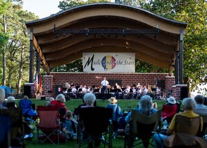 The U.S. Army Training and Doctrine Command Band perform during their annual Music Under the Stars in Magnolia Park at Fort Eustis, Va., June 9, 2016. Service members and community members came together during the ceremony to celebrate the U.S. Army’s 241st Birthday. (U.S. Air Force photo by Staff Sgt. J.D. Strong II)
