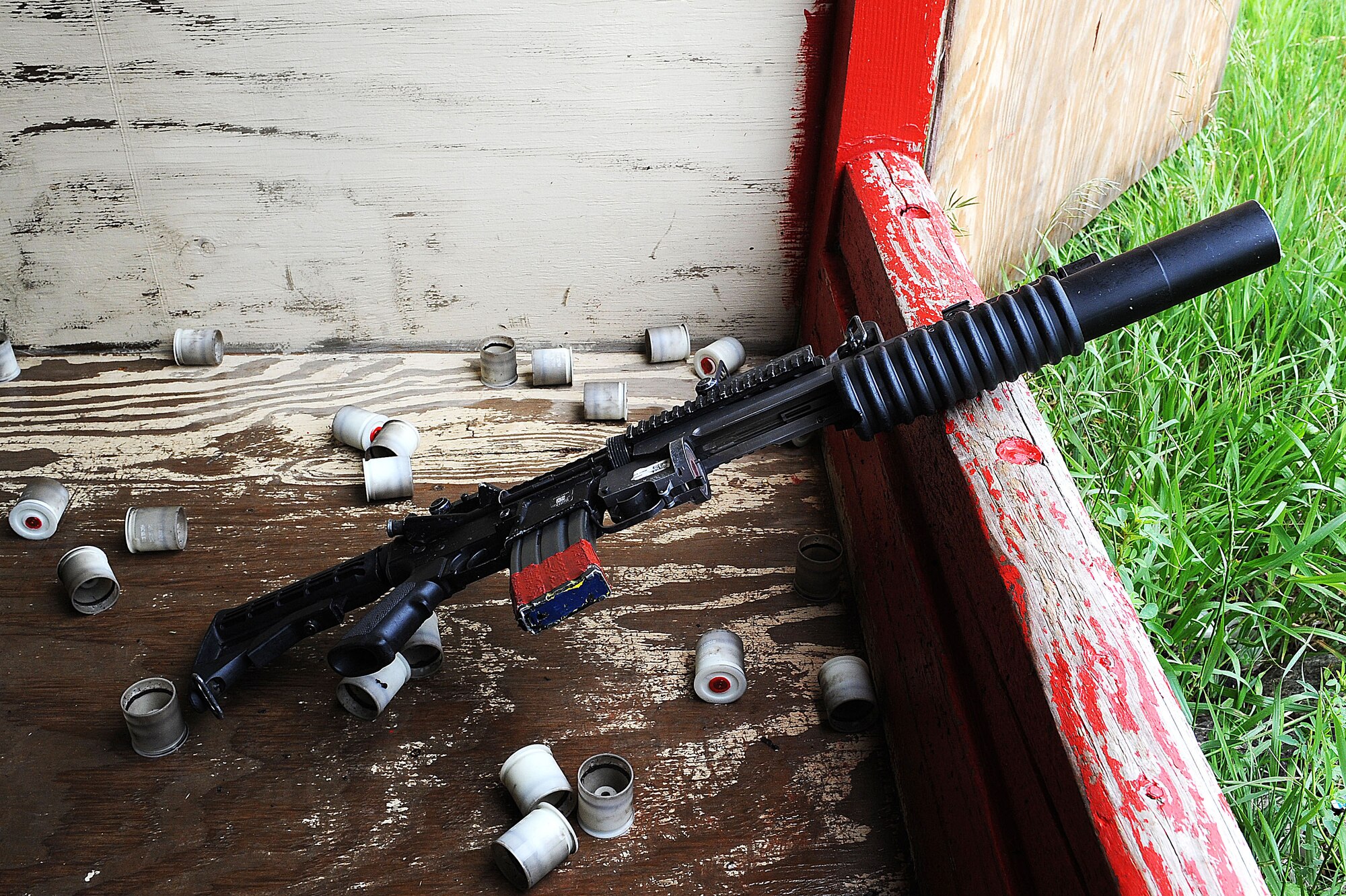 An M-203 grenade launcher rests on a ledge after being fired at Minot Air Force Base, N.D., June 15, 2016. Prior to firing, the defenders learned how to break down the M-203 and clean it. To carry the weapon, defenders must qualify annually. (U.S. Air Force photo/Senior Airman Kristoffer Kaubisch)