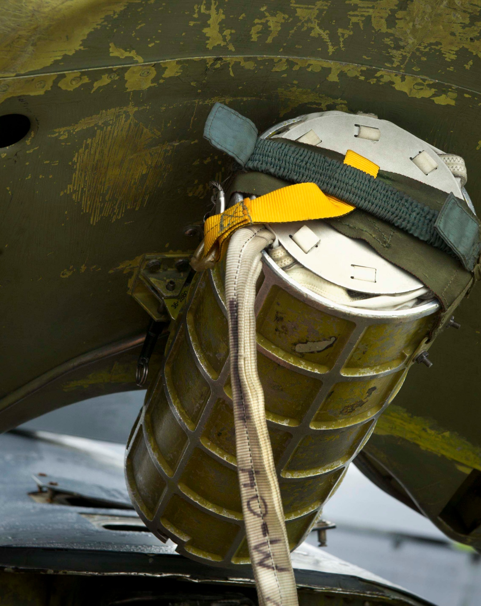 A pilot chute canister is loaded into a B-52H Stratofortress at RAF Fairford, United Kingdom, June 13, 2016. The pilot chute is packed into a canister and attached to the drag chute door separate from the main chute. It is spring loaded to assist in the deployment of the main chute. (U.S. Air Force photo/Senior Airman Sahara L. Fales)