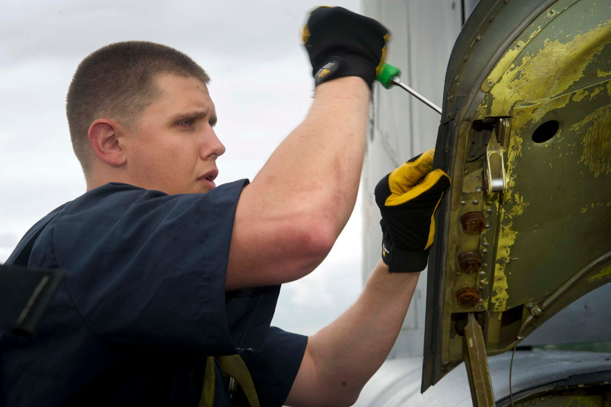 U.S. Air Force Staff Sgt. Justin Yochum, 5th Expeditionary Maintenance Squadron aerospace repair and reclamation journeyman, unscrews a panel to replace a drag chute on a B-52H Stratofortress at RAF Fairford, United Kingdom, June 13, 2016. The drag chute system consists of mechanisms which are used to close the drag chute door and to deploy and jettison the drag chute. Mechanisms are in place to prevent jettisoning the chute before deployment and to automatically jettison the chute if the drag chute door opens inadvertently. (U.S. Air Force photo/Senior Airman Sahara L. Fales)