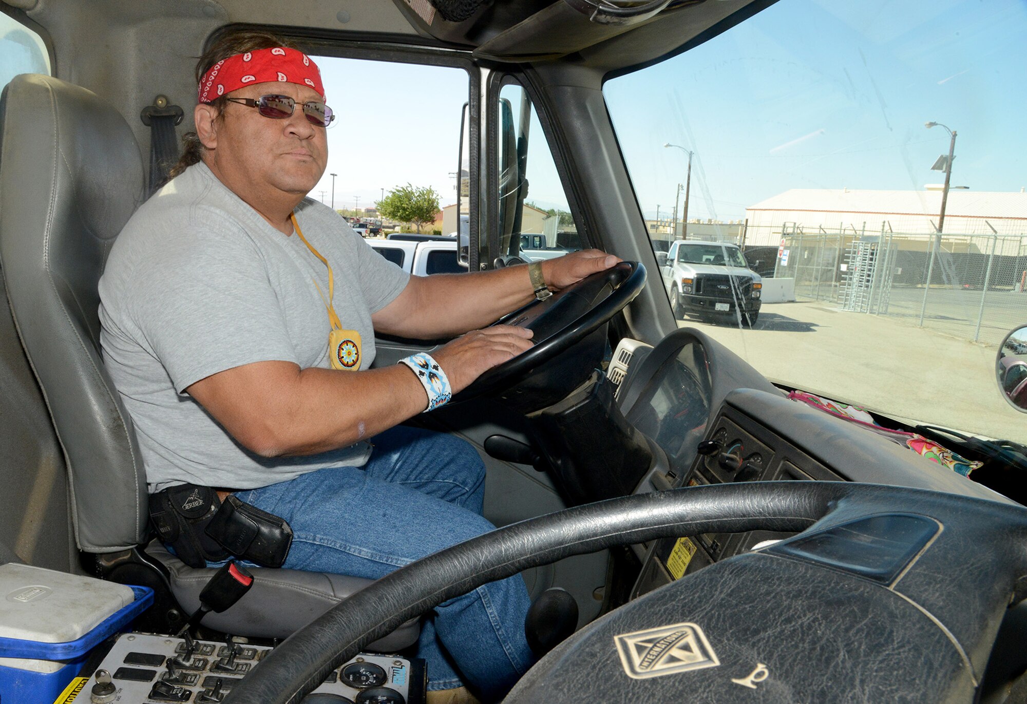 Heavy equipment operator Robin “Bubba” Hairston, 412th Civil Engineer Group, prepares to operate his sweeper truck, protecting lives and equipment by keeping the Edwards flightline free from debris . Hairston was recently honored by the Society of American Indian Government Employees for his contributions to the Edwards mission and to American Indians in government service. (U.S. Air Force photo by Christopher Ball.)