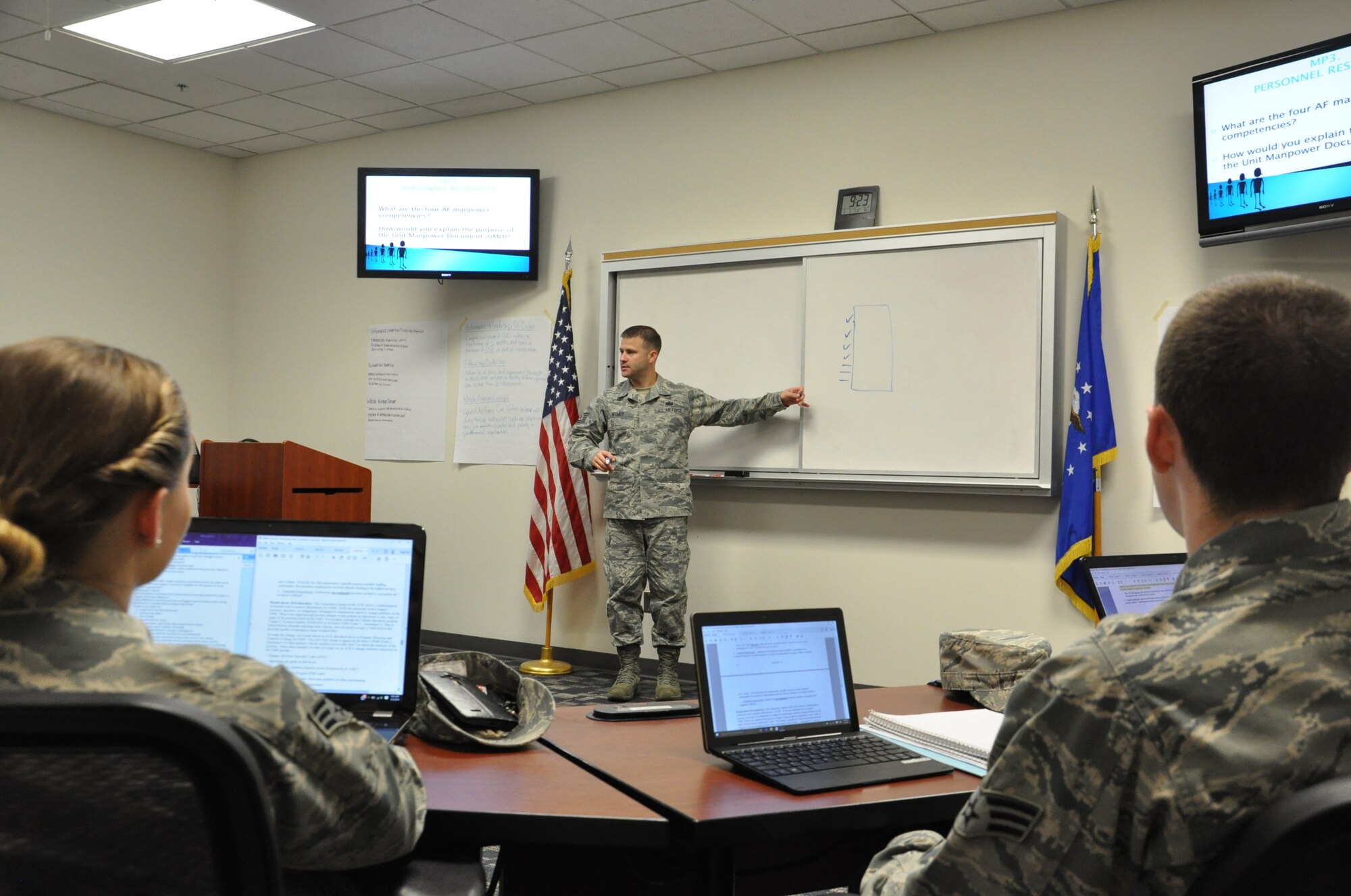 Tech Sgt. Richard Witmer refers to a chart on a lesson called Resource Stewardship. (US Air Force photo/Myra Saxon).