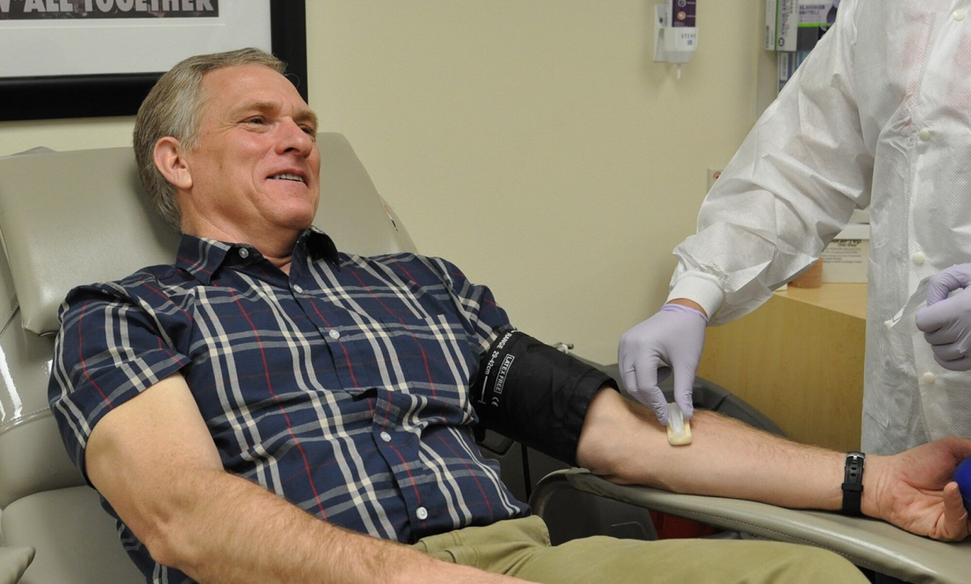 David McDaniel, an 88th Logistics Readiness Squadron support agreement manager, is prepped prior to needle insertion. (US Air Force photo/Myra Saxon).