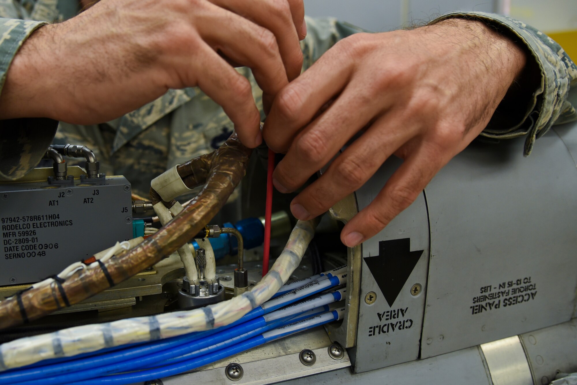 U.S. Air Force Tech. Sgt. William Rus, a 187th EW technician and production supervisor, Montgomery Regional Air National Guard Base, Ala., demonstrates how he works on an AN/ALQ-184 ECM pod June 2, 2016, at the Montgomery Regional ANGB, Ala. The purpose of the pods are to jam radar or other detection systems. The pods keep the wing’s F-16 Fighting Falcon and pilots safe when flying into enemy territory. (U.S. Air National Guard photo by Airman 1st Class Hayden Johnson/Released)