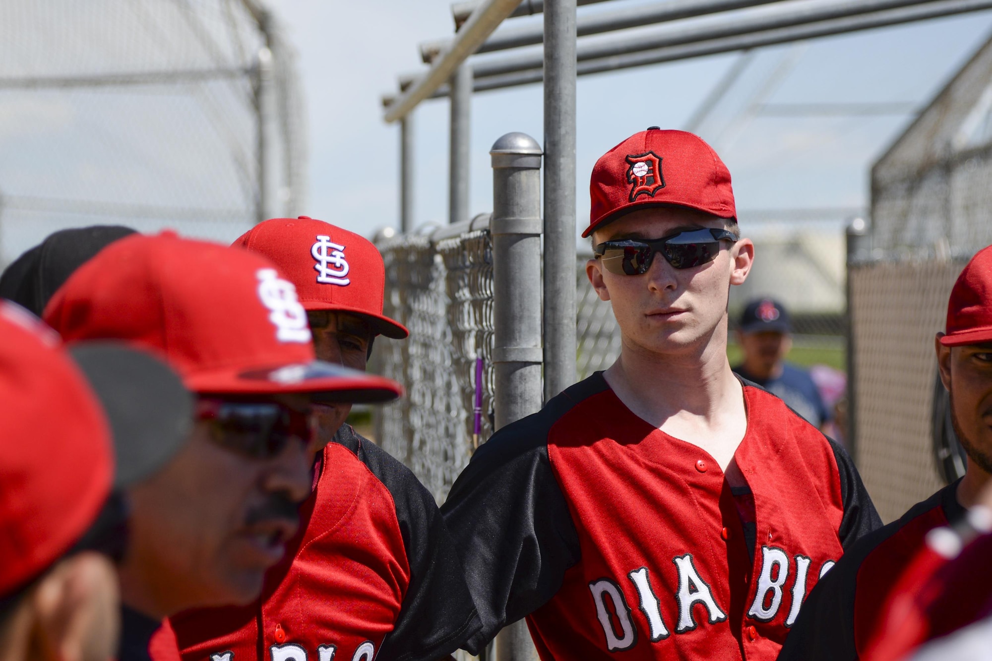 Senior Airman Devin Mooney, 321st Missile Squadron commander's support staff and Personnel Reliability Program monitor, listens to the coach of his Fort Collins league baseball team before a game May 29, 2016, on a baseball field in Colorado. Mooney has hopes to become the first Airman to transition into playing for the MLB. (U.S. Air Force photo by Senior Airman Jason Wiese)