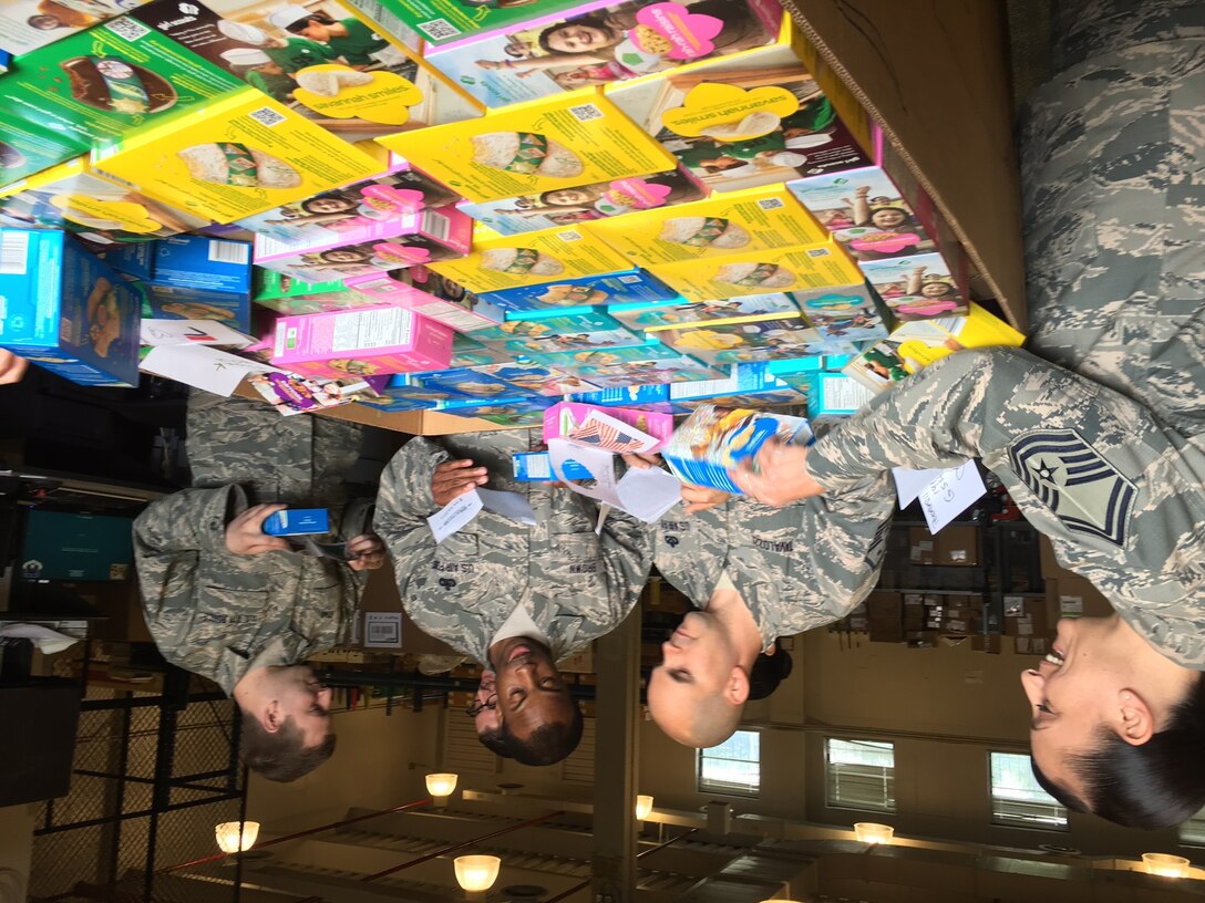 Girl Scouts of Hudson Valley Region, New York sent over 6000 cookies to the service members at Joint Base Andrews. Senior Master Sgt. Erica Rose, far left, received a note from Amanda, a Girl Scout from Westchester, NY who has participated in Operation Cookie Drop since she was 5 years old. Your note made our day as much as the cookies did!  (US Air Force Photo by Melanie Moore/Released)