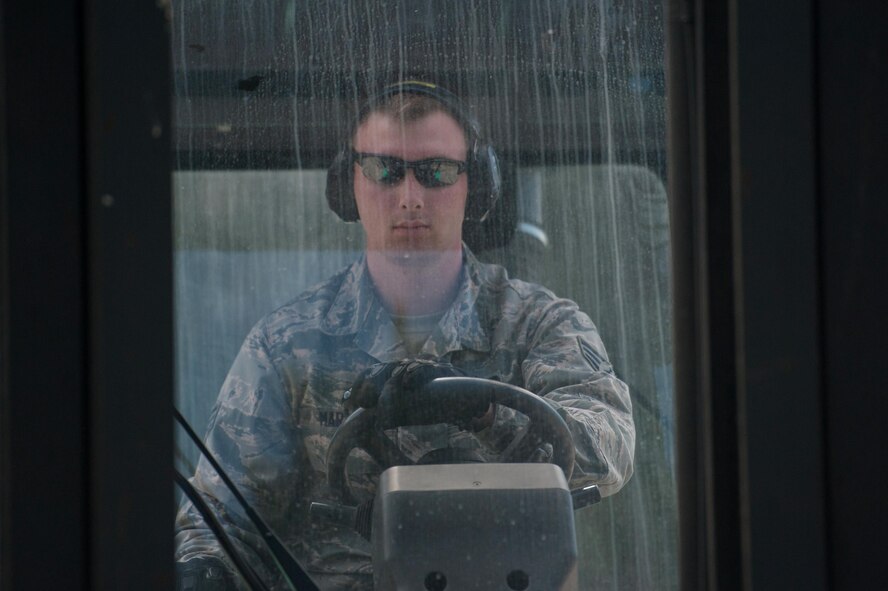 Senior Airman Joshua Martin, 821st Contingency Response Support Squadron Aerial Porter, offloads pallets with a forklift during Exercise Swift Response 16 at the Bydgoszcz Airport, Poland, June 8, 2016. Exercise SR16 is one of the premier military crisis response training events for multinational airborne forces in the world, the exercise has more than 5,000 participants from 10 NATO nations. (U.S. Air Force photo by Master Sgt. Joseph Swafford/Released)