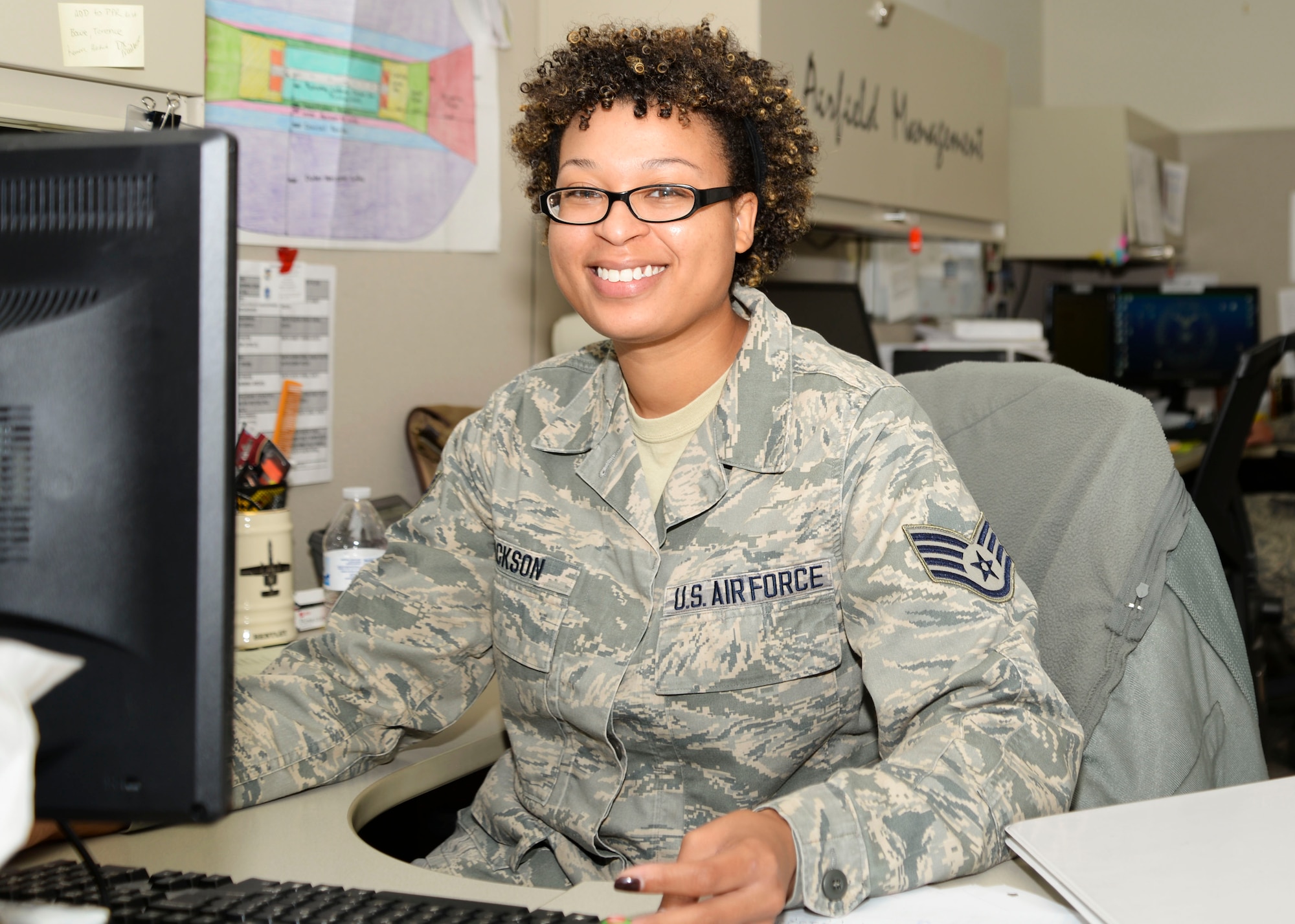 SSgt. Nastasia Jackson sits at her desk preparing to process paperwork June 15, 2016 at Warfield Air National Guard Base, Middle River, Md. Jackson is the Maryland Air National Guard June Spotlight Airman. (U.S. Air National Guard photo by Airman 1st Class Enjoli Saunders/RELEASED) 