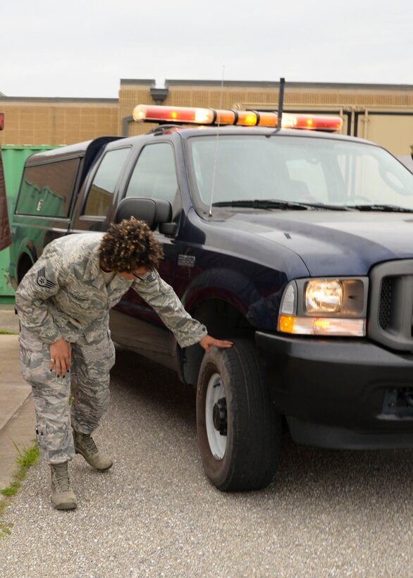SSgt. Nastasia Jackson checks the vehicle that she will be using for her daily airfield inspection that is necessary to ensure the safety of the flight line June 15, 2016 at Warfield Air National Guard Base, Middle River, Md. Jackson is the Maryland Air National Guard June Spotlight Airman. (U.S. Air National Guard photo by Airman 1st Class Enjoli Saunders/RELEASED) 