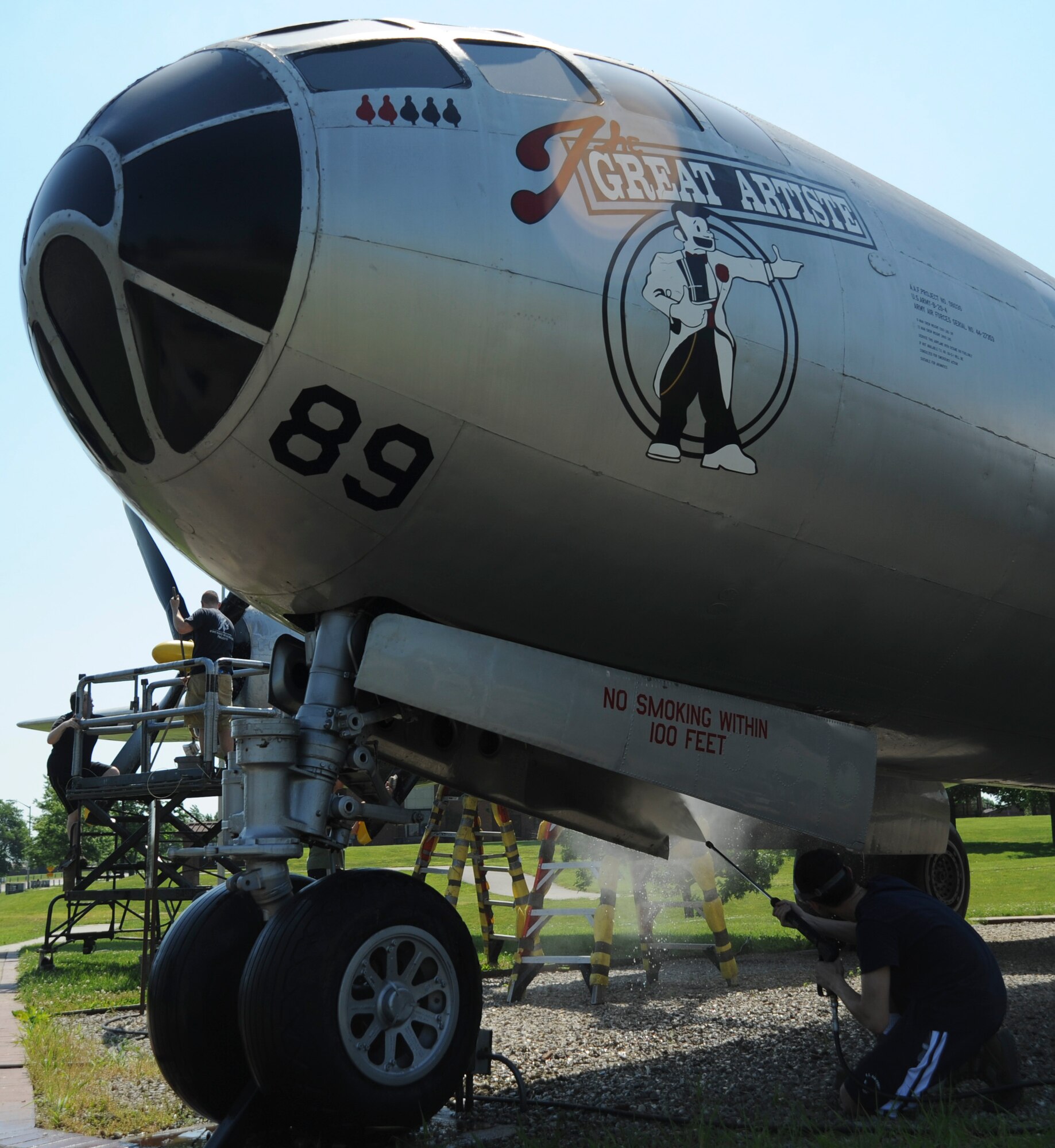 U.S. Air Force Airman 1st Class Juan Vazquez, an aerospace propulsion apprentice assigned to the 509th Aircraft Maintenance Squadron, power washes the Boeing B-29 Superfortress static display at Whiteman Air Force Base, Mo., June 10, 2016. The original Great Artiste was the only aircraft to fly during both atomic bomb missions on Hiroshima and Nagasaki in 1945. (U.S. Air Force photo by Senior Airman Danielle Quilla)
