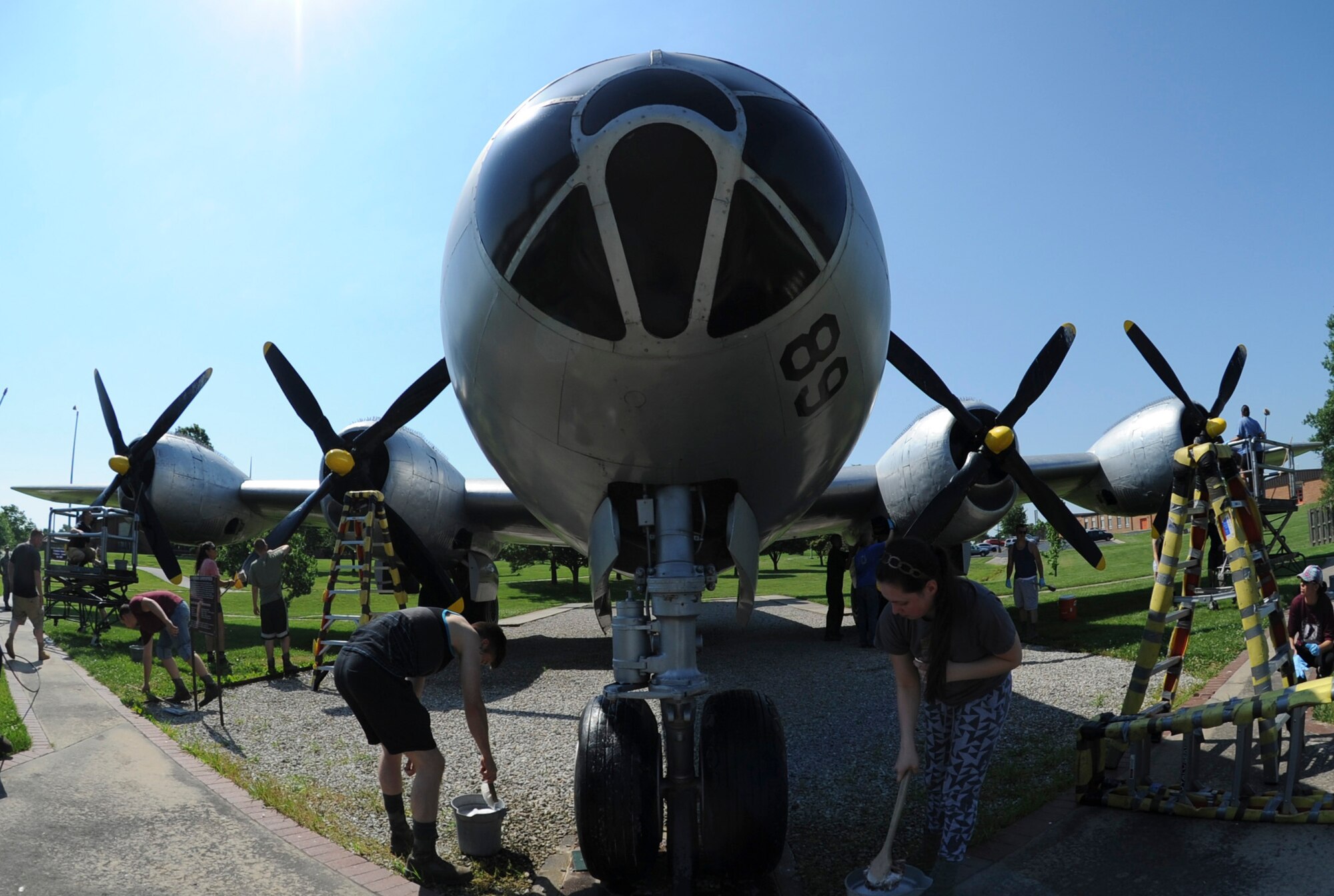 Members of the 509th Aircraft Maintenance Squadron wash the Boeing B-29 Superfortress static display at Whiteman Air Force Base, Mo., June 10, 2016. Under the United States Air Force Heritage Program at Whiteman, all static displays are adopted by at least one unit to be properly maintained. (U.S. Air Force photo by Senior Airman Danielle Quilla)
