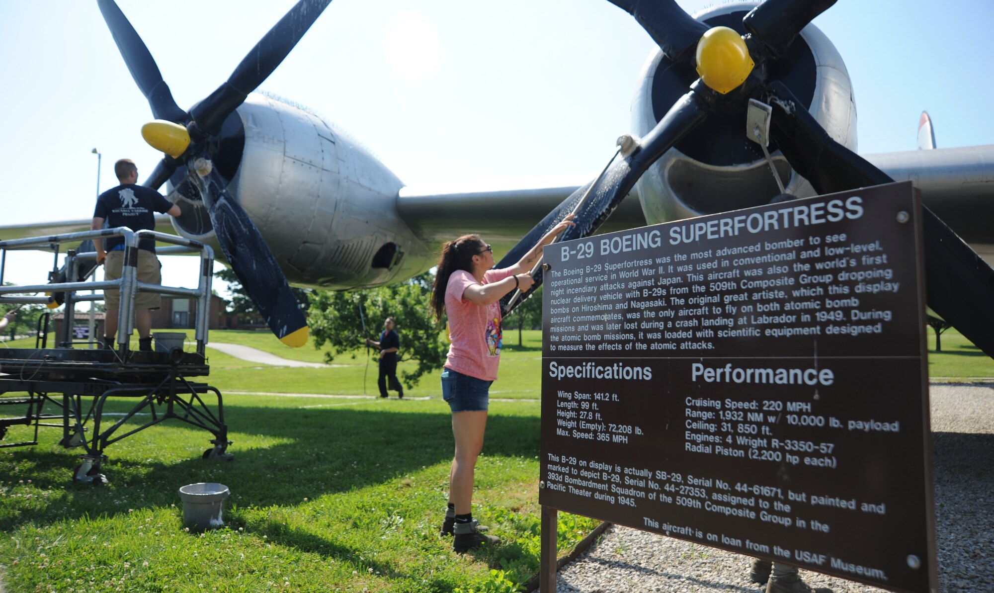 Members of the 509th Aircraft Maintenance Squadron clean the propellers of the Boeing B-29 Superfortress static display at Whiteman Air Force Base, Mo., June 10, 2016. Each static display on base should be washed at least twice a year to reduce the potential of corrosion and maintain the overall integrity of the aircraft. (U.S. Air Force photo by Senior Airman Danielle Quilla)