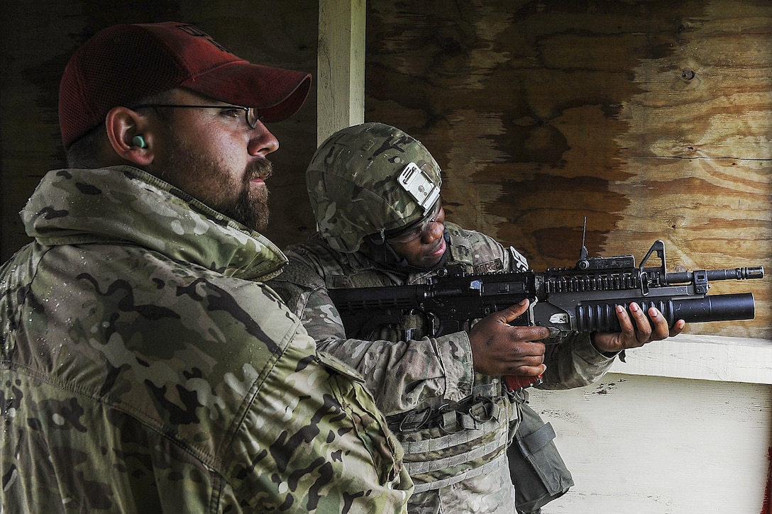 Airmen fire a grenade launcher at Minot Air Force Base, N.D., June 15, 2016. Before firing, the airmen learned how to break down the launcher and clean it. Air Force photo by Senior Airman Kristoffer Kaubisch