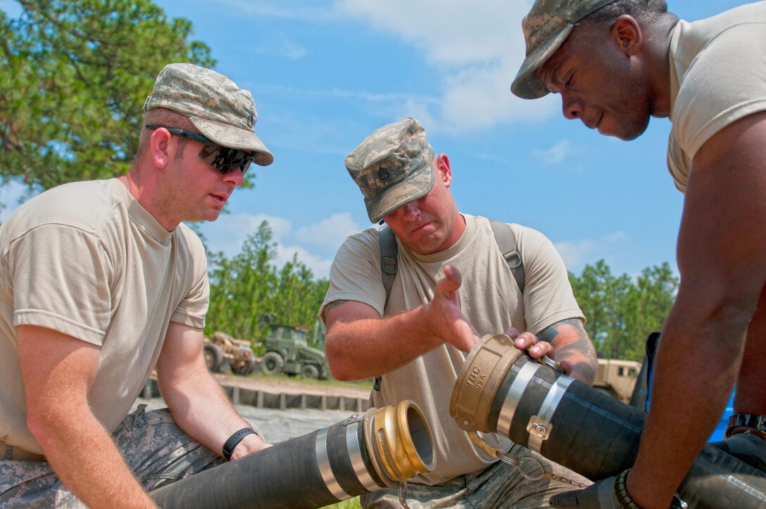 Army Staff Sgt. John Radtka inspects a fuel hose for dirt during the annual Quartermaster Liquid Logistics Exercise at Fort Bragg, N.C., June 14, 2016. Radtka is assigned to the 192nd Quartermaster Company. Army photo by Staff Sgt. Dalton Smith