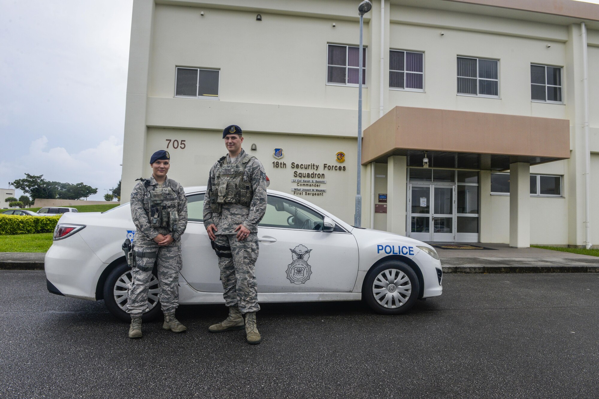 Staff Sgt. Troy Turnbo and Airman 1st Class Rachel Dolan, 18th Security Forces Squadron patrolmen, get ready to go out on patrol at Kadena Air Base, Japan, June 13, 2016. To be a "Defender," it takes a high volume of training and the knowledge in weaponry, laws, directives and programs, policies, and procedures governing security forces activities, as well as a motivated individual ready for the task at hand. (U.S. Air Force photo by Senior Airman Stephen G. Eigel)