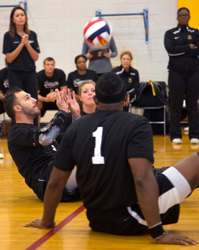 Army veteran Robbie Gaupp prepares to hit a two-hand return in a sitting volleyball match against the Britain team during the 2016 Department of Defense Warrior Games at the U.S. Military Academy in West Point, N.Y., June 15, 2016. Army photo by Spc. Sarah Pond