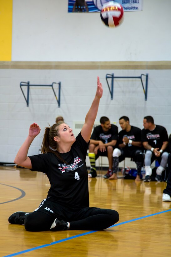Army Staff Sgt. Ashley Anderson serves the ball for Team Army during a sitting volleyball match at the 2016 Department of Defense Warrior Games at the U.S. Military Academy in West Point, N.Y., June 15, 2016. Army photo by Spc. CaShaunta Q. Williams