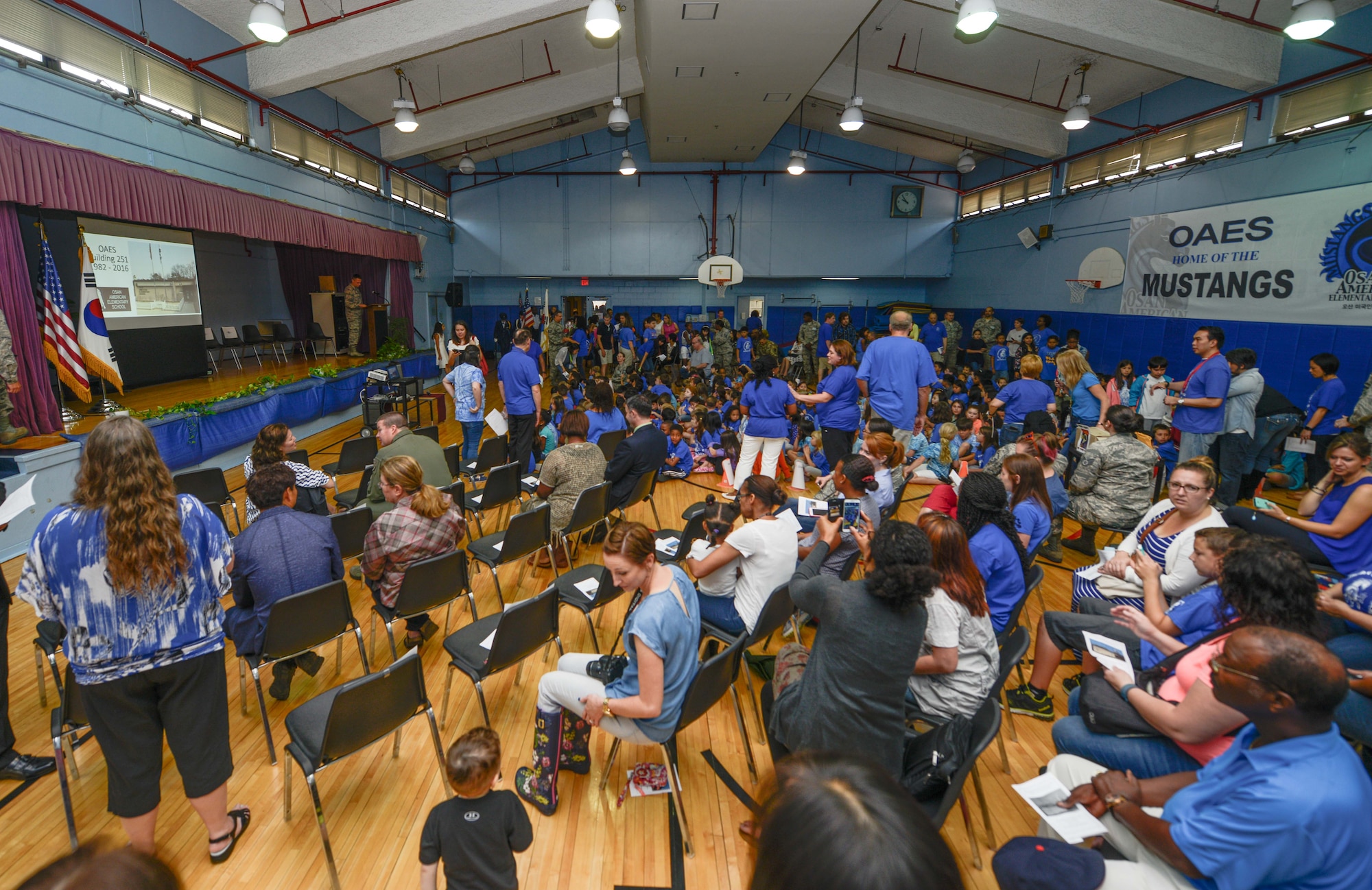Members of Team Osan attend the base’s elementary school closing ceremony June 15, 2016, at Osan Air Base, Republic of Korea. Students delivered speeches, participated in honor guard formations and compiled a time capsule during their school’s closing. (U.S. Air Force photo by Senior Airman Dillian Bamman/Released)