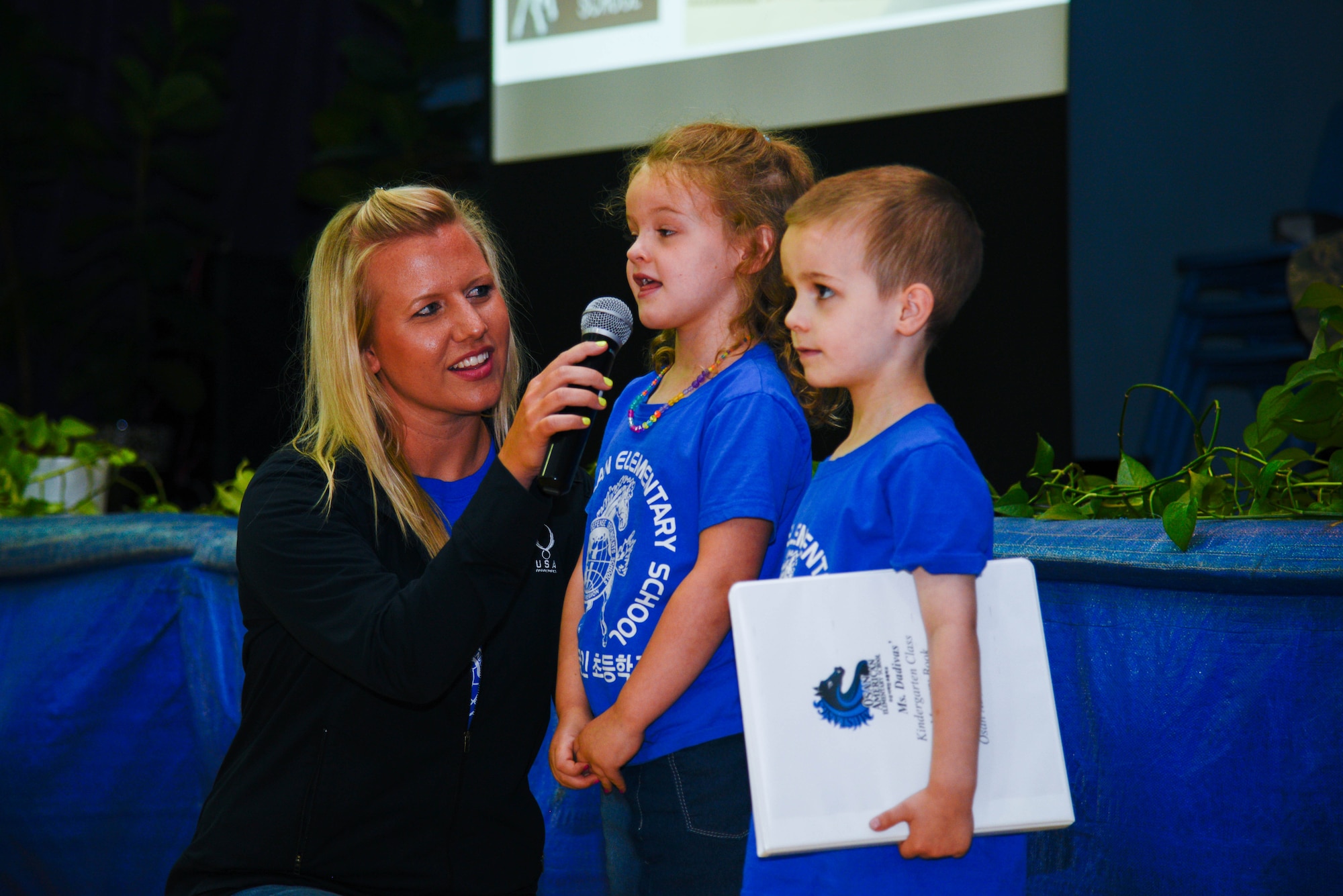 Students from Osan Elementary School perform a speech before adding to a time capsule during the school’s closing ceremony June 15, 2016, at Osan Air Base, Republic of Korea. The students added a photo collection of their class to a time capsule. (U.S. Air Force photo by Senior Airman Dillian Bamman/Released)