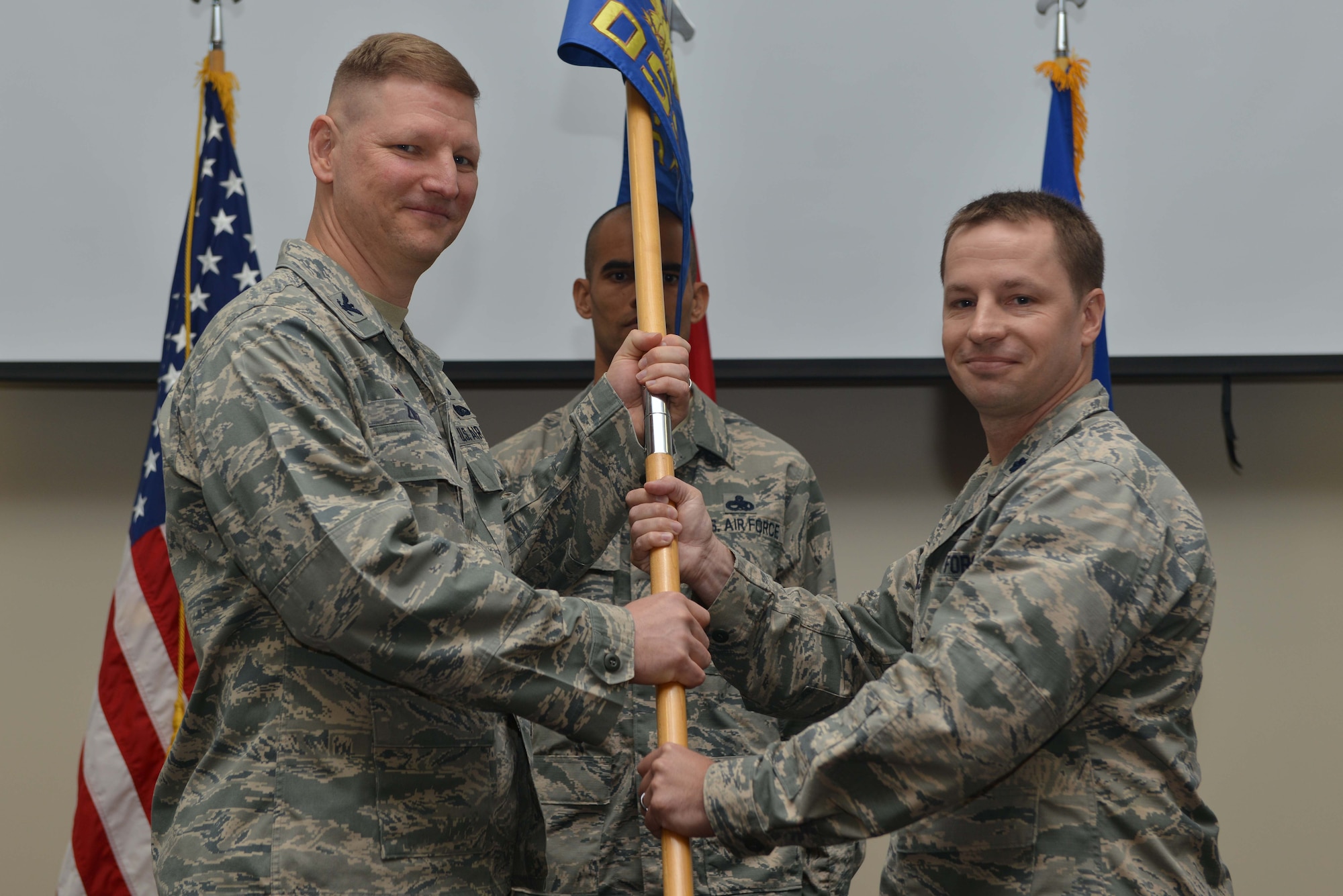U.S. Air Force Lt. Col. Kyle Wilson, 39th Operations Support Squadron outgoing commander, relinquishes command to U.S. Air Force Col. James Zirkel, 39th Weapons System Security Group commander, during a change of command ceremony June 16, 2016, at Incirlik Air Base, Turkey. Wilson was responsible for providing airfield management, air traffic control, airfield systems and radar maintenance, weapons and tactics, intelligence and weather support to joint and coalition forces in Turkey, NATO and overseas contingency operations. (U.S. Air Force photo by Senior Airman John Nieves Camacho/Released)