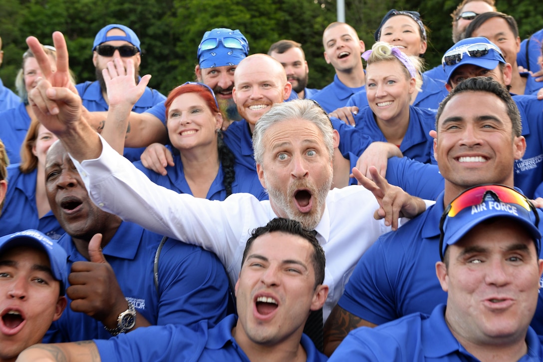 Comedian Jon Stewart poses for a photograph with the Air Force team before the opening ceremony of the 2016 Warrior Games at the U.S. Military Academy in West Point, N.Y., June 15, 2016. DoD photo by EJ Hersom