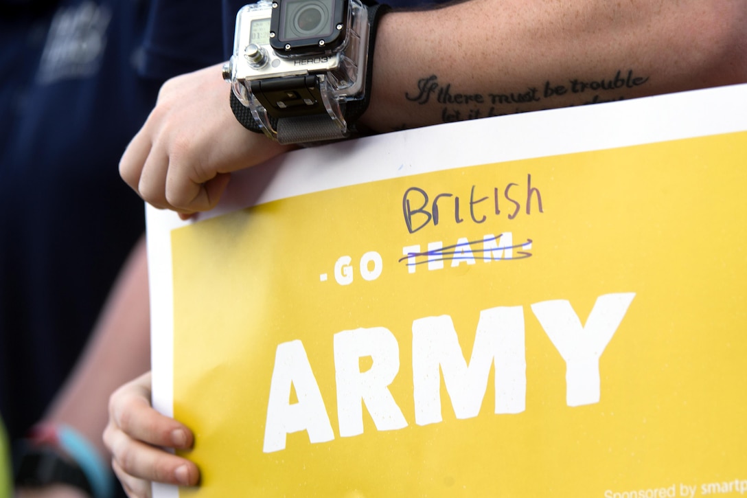 A British soldier displays a sign during the 2016  Warrior Games opening ceremony at the U.S. Military Academy in West Point, N.Y., June 15, 2016. DoD photo by EJ Hersom