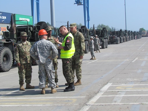 U.S. and Polish Soldiers ready a convoy of vehicles of the 361st Multi Role Bridge Co. to leave the port in Szczecin, Poland to take part in Exercise Anakonda 16. 