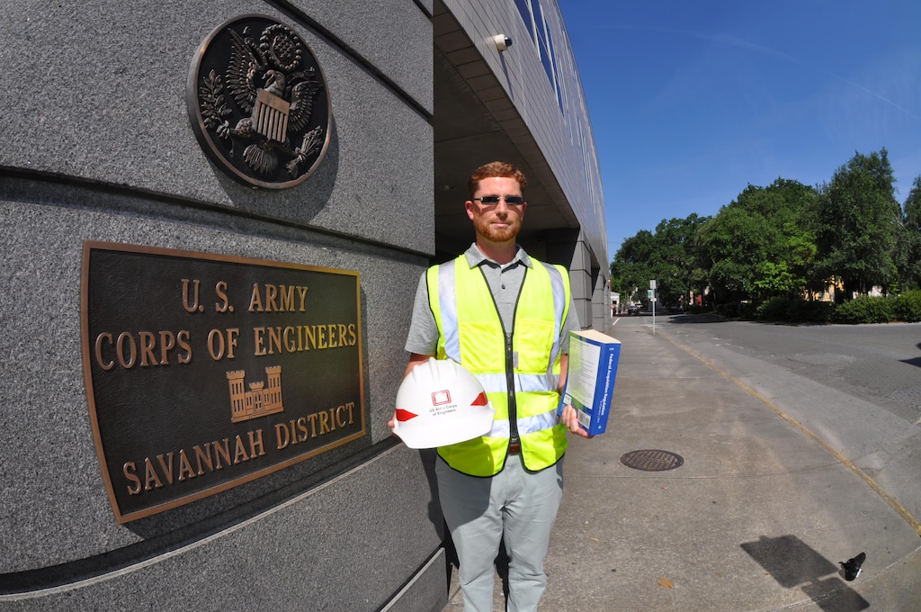 Mark Hiscox, a student in Auburn University's Construction Management Program and contracting specialist at the Savannah District, displays contracting and construction tools of the trade at district headquarters June 15, 2016. Hiscox is one of more than 60 district employees who've enrolled in the degree-awarding program promoted to mend information and communication gaps between construction and contracting specialists. The program blends practical and professional construction education principles for working professionals. It also focuses on holistic communities of practice for students who need to understand interdisciplinary concepts in dynamic team environments.