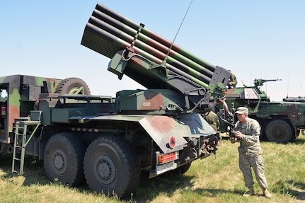 Spc. Martin Fender, assigned to the 5th Battalion, 113th Field Artillery Regiment (High Mobility Artillery Rocket System), North Carolina Army National Guard, aims a 122mm WR-40 Langusta self-propelled multiple rocket launcher with the sighting mechanism at the Jaworze Training Area, Poland, during Exercise Anakonda 16 on June 5, 2016. 