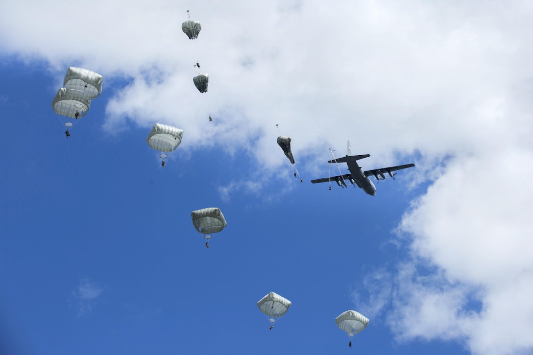 Paratroopers jump from a C-130 aircraft during Anakonda 2016 at the Piaskowi drop zone in Drawsko Pomorskie, Poland, June 6, 2016. The paratroopers are assigned to the 173rd Airborne Brigade. Exercise Anakonda 2016 involves more than 25,000 participants from more than 20 nations. Army photo by Pfc. Antonio Lewis