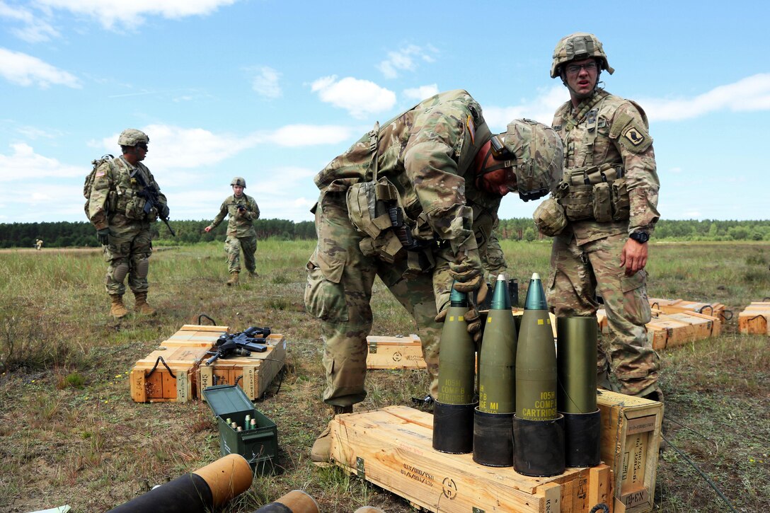 Army paratroopers prepare ammunition for a M777 howitzer fire mission during Anakonda 2016 at Piaskowi drop zone in Drawsko Pomorskie, Poland, June 6, 2016. Army photo by Pfc. Antonio Lewis