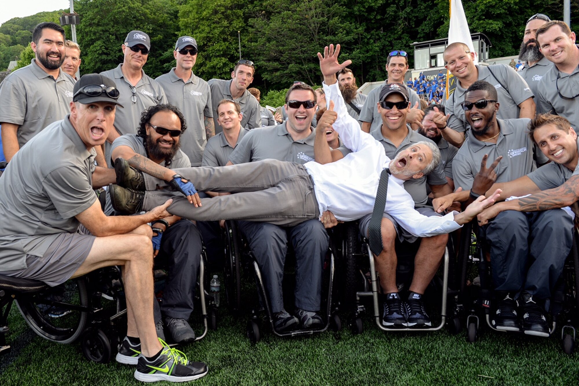 Comedian Jon Stewart, most notably of The Daily Show, poses for a photo with the U.S. Special Operations Command team during the 2016 Department of Defense Warrior Games on June 15, 2016. (Department of Defense photo/EJ Hersom)