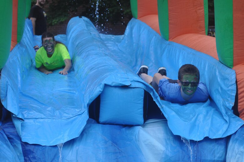 Participants have fun on the waterslide, which is part of the first leg of the Run Amuck and Mini Run Amuck courses.