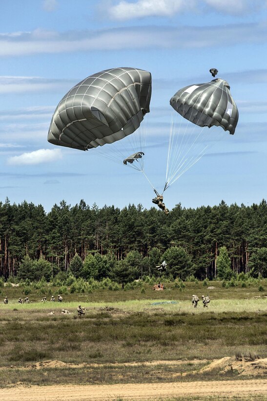 An Army paratrooper descends over the Piaskowi drop zone during Anakonda 2016 in Drawsko Pomorskie, Poland, June 6, 2016. Army photo by Pfc. Antonio Lewis