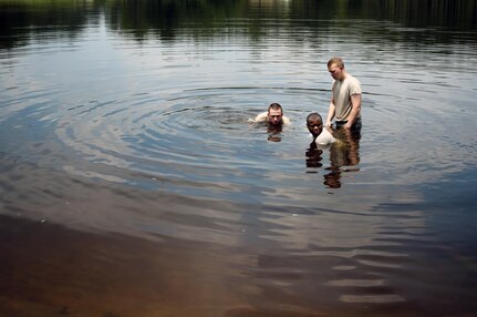 U.S. Army Reserve water treatment specialists, with the 810th Quartermaster Company, an Army Reserve unit from Maineville, Ohio, secure a water pump in Mott Lake during the annual Quartermaster Liquid Logistics Exercise (QLLEX), at Fort Bragg, N.C., June 14, 2016. QLLEX is an annual logistical movement event that will transport necessary petroleum and purified water throughout the U.S. (Sgt. Christopher Bigelow / Released)(Sgt. Christopher Bigelow/Released)