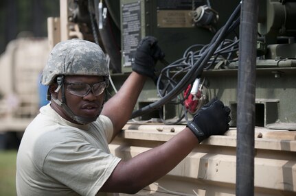 Spc. Christian Brooks, a petroleum supply specialist with the 172nd Quartermaster Company, operates a fuel pump during the annual Quartermaster Liquid Logistics Exercise (QLLEX), at Fort Bragg, N.C., June 14, 2016. QLLEX is an annual logistical movement event that will transport necessary petroleum and purified water throughout the U.S. (Sgt. Christopher Bigelow / Released)