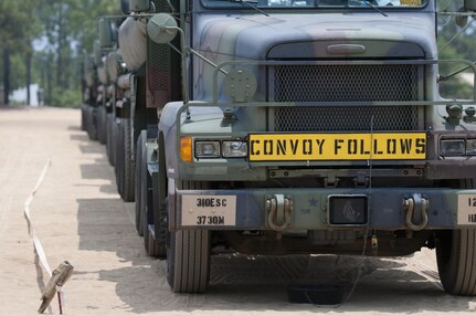 A motor vehicle convoy is staged to deploy in a training area during the annual Quartermaster Liquid Logistics Exercise (QLLEX), at Fort Bragg, N.C., June 14, 2016. QLLEX is an annual logistical movement event that will transport necessary petroleum and purified water throughout the U.S. (Sgt. Christopher Bigelow / Released)