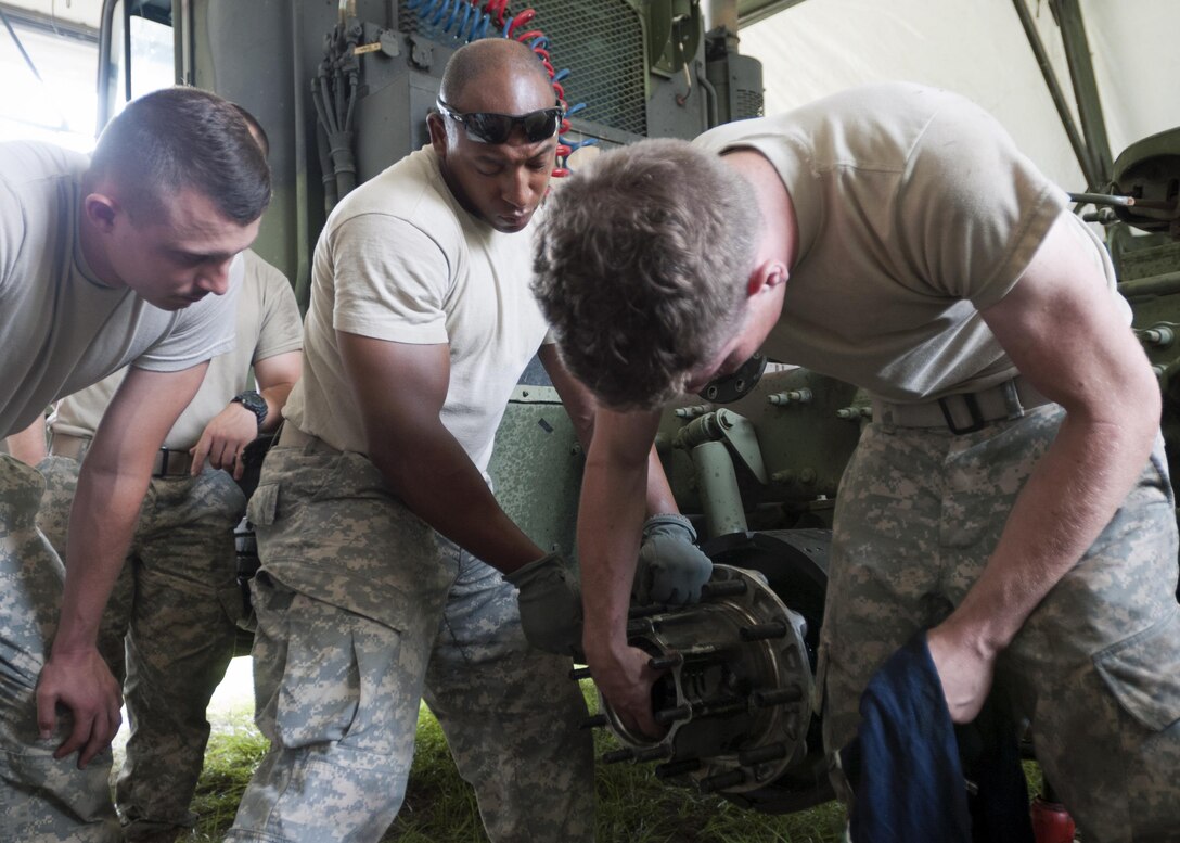 Soldiers from the 655th Transportation Company, provide maintenance to a M916 Light Equipment Transporter, during the annual Quartermaster Liquid Logistics Exercise (QLLEX), at Fort Bragg, N.C., June 14, 2016. QLLEX is an annual logistical movement event that will transport necessary petroleum and purified water throughout the U.S. (Sgt. Christopher Bigelow / Released)