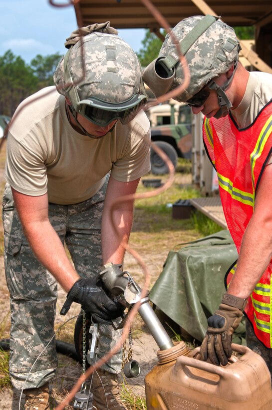 Spc. Paul Delucia, with the 192nd Quartermaster Company, based out of Milan, Oh., fills up a fuel can with diesel fuel during the annual Quartermaster Liquid Logistics Exercise (QLLEX) at Fort Bragg, N.C., June 15, 2016. (U.S. Army photo by Staff Sgt. Dalton Smith/Released)