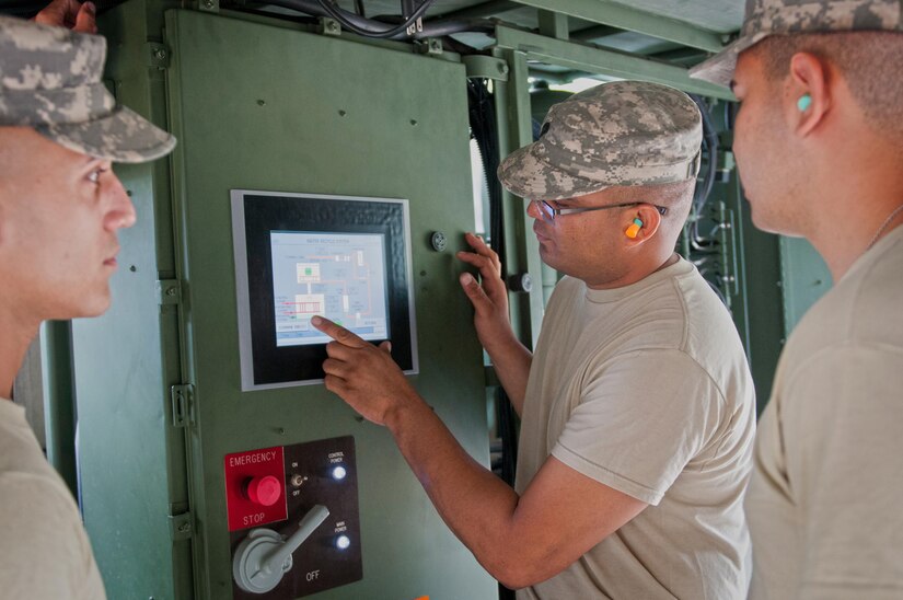 Spc. Joel Cruz, with the 597th Quartermaster Company, an Army Reserve unit based out of Puerto Nuevo, Puerto Rico, instructs fellow Soldiers how to operate the Laundry Advanced System (LADS) during the annual Quartermaster Liquid Logistics Exercise (QLLEX) at Fort Bragg, N.C., June 15, 2016. (U.S. Army photo by Staff Sgt. Dalton Smith/Released)