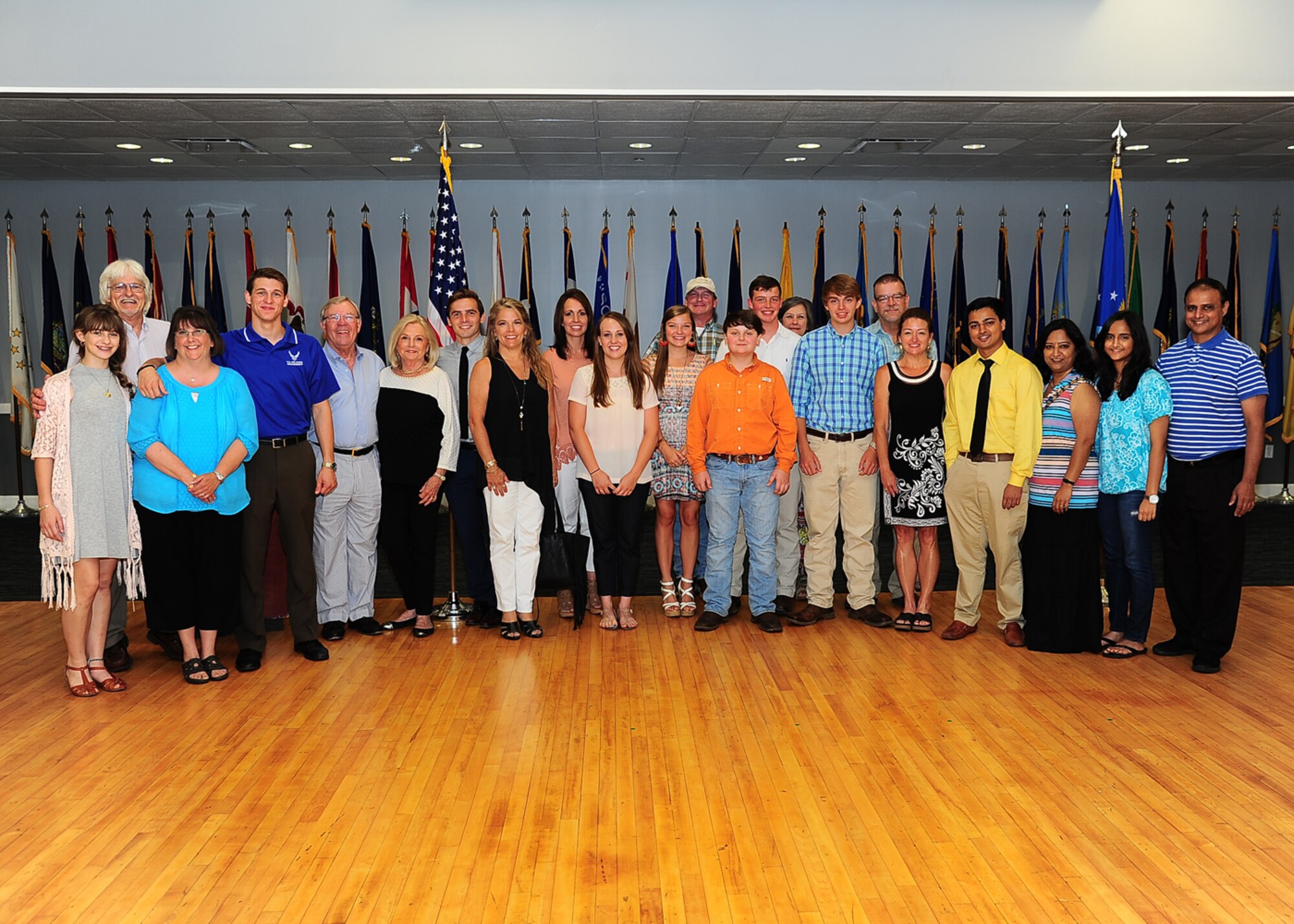 Five Mississippi high school graduates who were appointed to the United States Air Force Academy pause for a photo with their families at a dinner held June 9 at the Columbus Club on Columbus Air Force Base, Mississippi. The dinner celebrated their selection to the U.S. Air Force Academy, where the students will study mathematics, English, Science, and Military History, while also participating in strenuous military training and athletic programs. After four years, the students will graduate and commission as second lieutenants in the United States Air Force. The state of Mississippi had eight high school graduates chosen to attend the Air Force Academy this year. (U.S. Air Force Photo/Staff Sgt. Stephanie Englar)