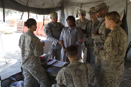 U.S. Army Reserve Soldiers, 812th Military Police Company, Orangeburg, N.Y., in-process a costumed role player during a detainee transfer operations training scenario as part of Combat Support Training Exercise 91-16-02, Fort Hunter Liggett, Calif., on June 13, 2016. As the largest U.S. Army Reserve training exercise, CSTX 91-16-02 provides Soldiers with unique opportunities to sharpen their technical and tactical skills in combat-like conditions. (U.S. Army photo by Sgt. Krista L. Rayford, 367th Mobile Public Affairs Detachment)